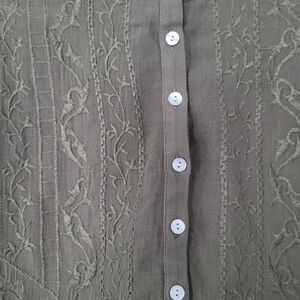 2 Lucky Brand short sleeve tops. One navy and white and the other olive green.